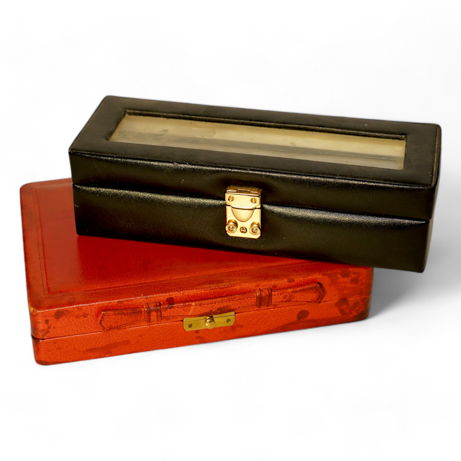 A Geoffrey Parker red leather backgammon set and a black leatherette wrist watch case